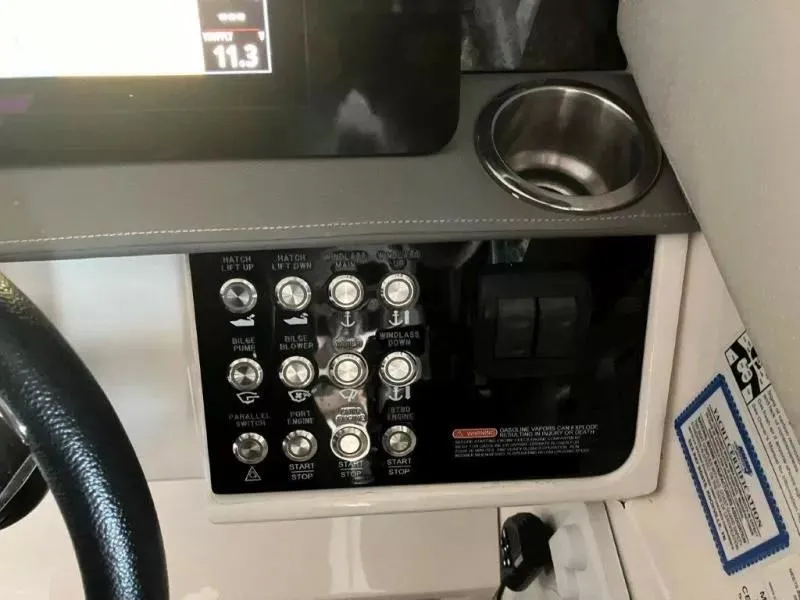 Slide: The Image of Control panel of 2020 Sea Ray Sundancer 320 OB boat with cup holder. - 16