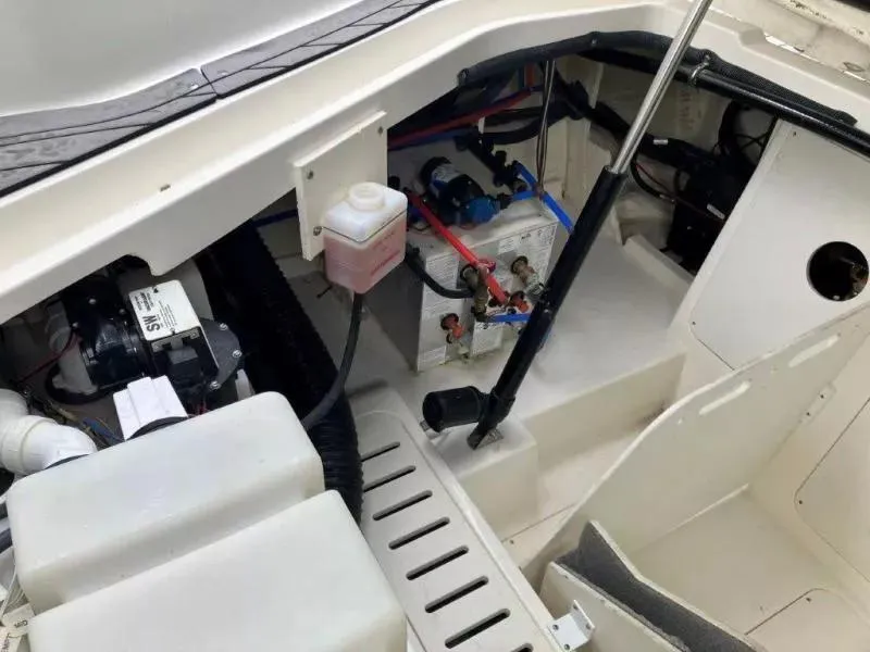 Slide: The Image of 2020 Sea Ray Sundancer 320 OB engine compartment with battery and wiring. - 22