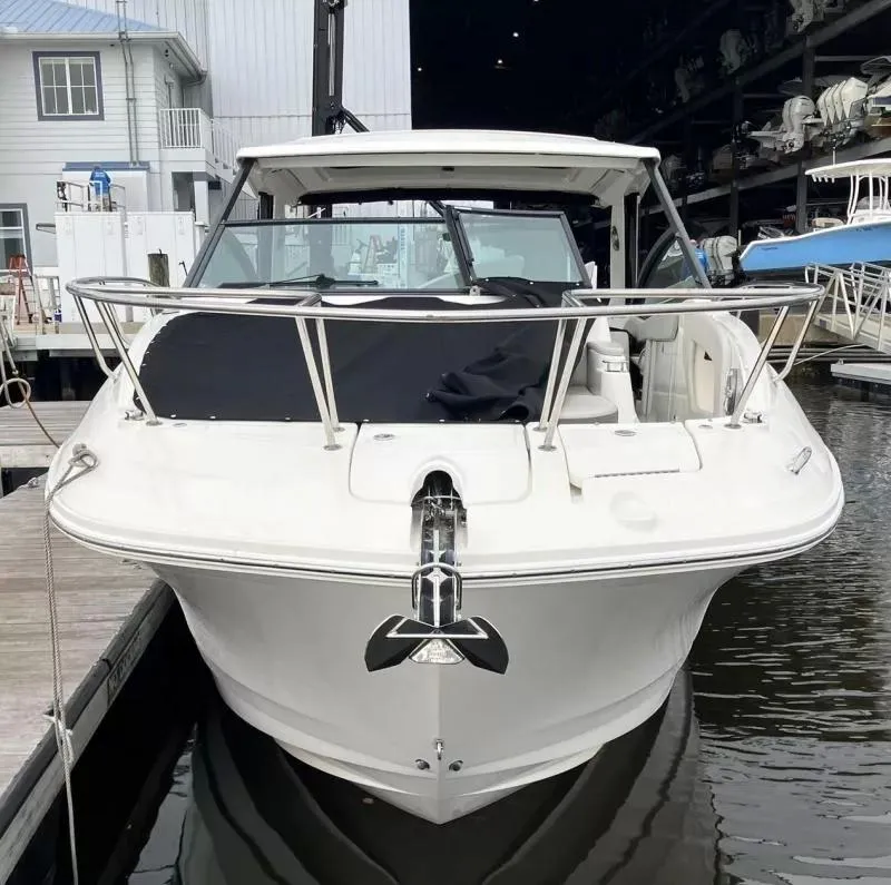 Slide: The Image of 2020 Sea Ray Sundancer 320 OB docked at marina, front view. - 5