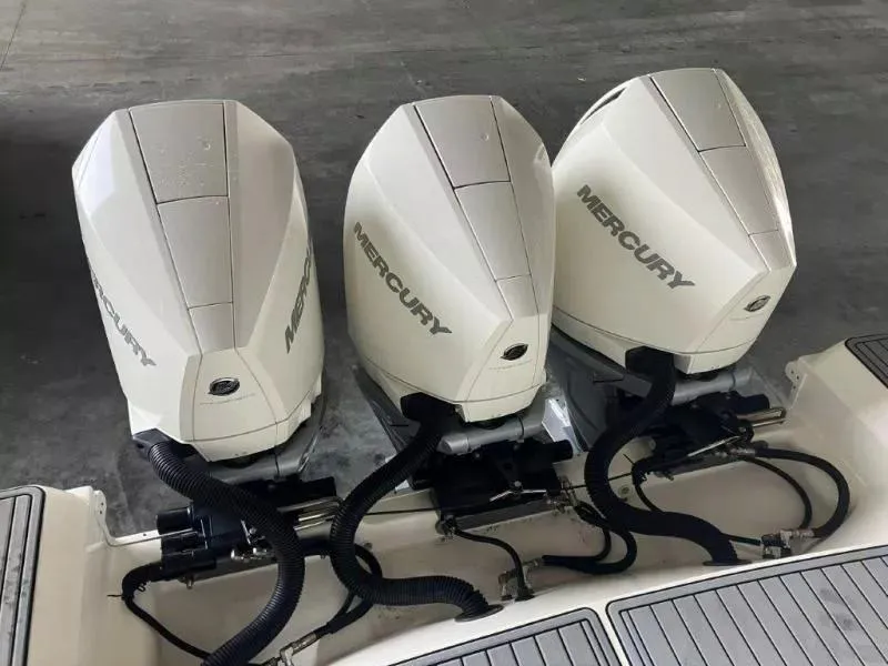Slide: The Image of Triple Mercury outboard engines on a 2020 Sea Ray Sundancer 320 OB boat. - 8