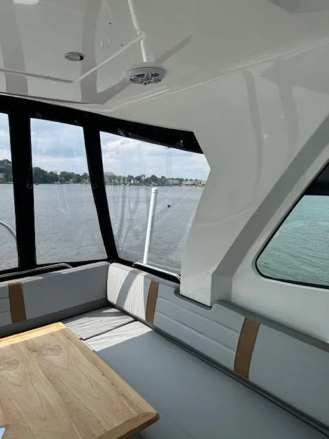 Slide: The Image of Interior of 2024 Beneteau Gran Turismo 32 yacht with waterfront view. - 10