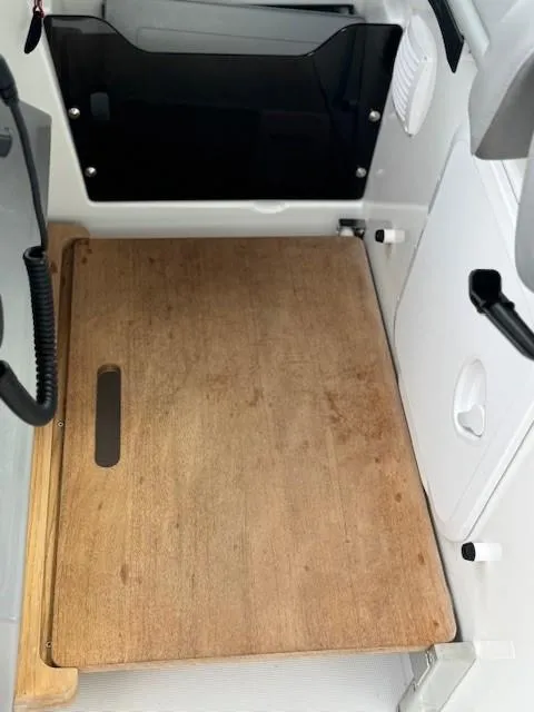 Slide: The Image of 2024 Beneteau Gran Turismo 32 interior with wooden flooring and modern design elements. - 19