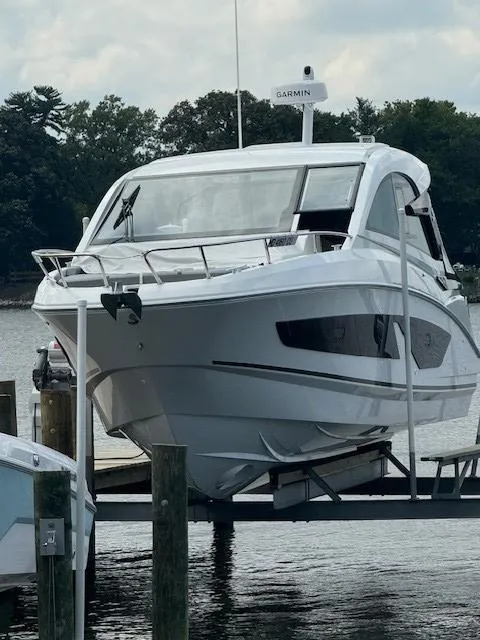 Slide: The Image of 2024 Beneteau Gran Turismo 32 yacht docked, featuring sleek design and modern amenities. - 2