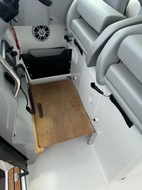 Slide: The Image of 2024 Beneteau Gran Turismo 32 interior with seating and wooden flooring. - 20