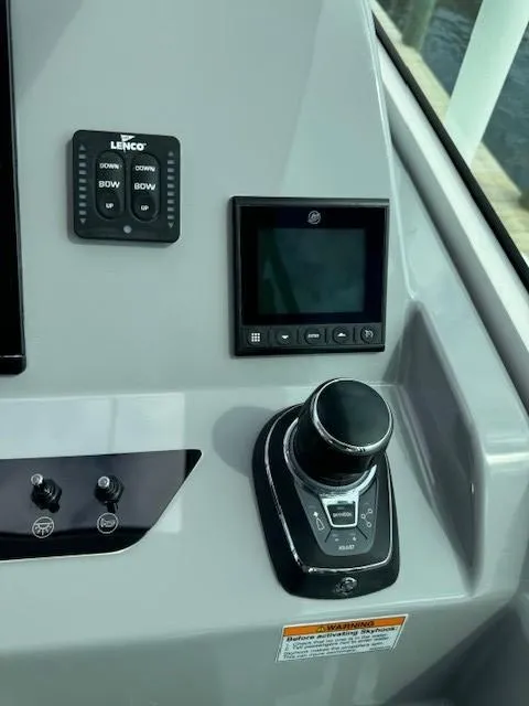 Slide: The Image of Control panel of 2024 Beneteau Gran Turismo 32 yacht with joystick and display. - 22