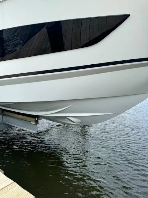 Slide: The Image of 2024 Beneteau Gran Turismo 32 yacht hull above water, showcasing sleek design. - 4