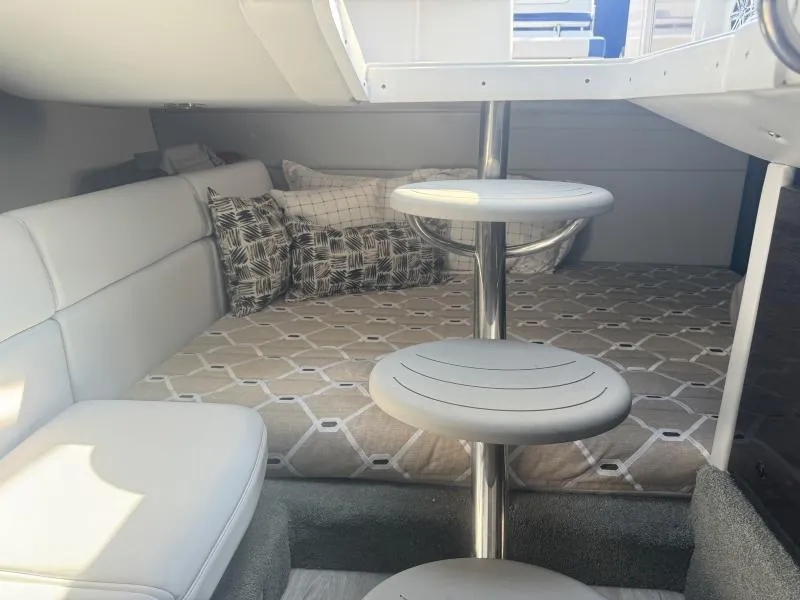 Slide: The Image of 2020 Formula Boats 350 Crossover Bowrider cabin interior with modern seating and bedding. - 10