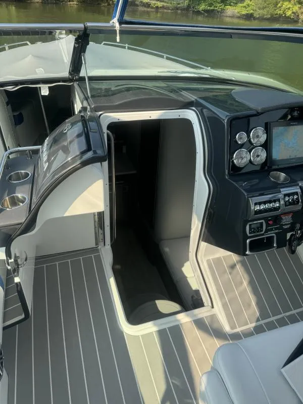 Slide: The Image of 2020 Formula Boats 350 Crossover Bowrider cockpit with modern controls and sleek design. - 14