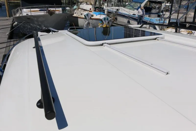 Slide: The Image of 2023 Beneteau Antares 8 boat roof with hatch, docked at marina. - 16