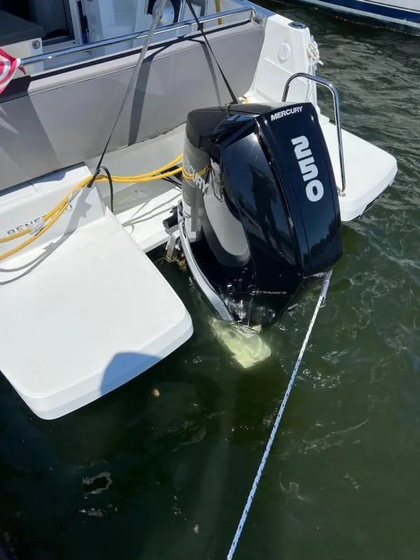 Slide: The Image of 2023 Beneteau Antares 8 with Mercury 250 outboard motor in water. - 17