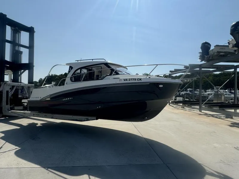 Slide: The Image of 2023 Beneteau Antares 8 boat on lift under clear sky. - 2
