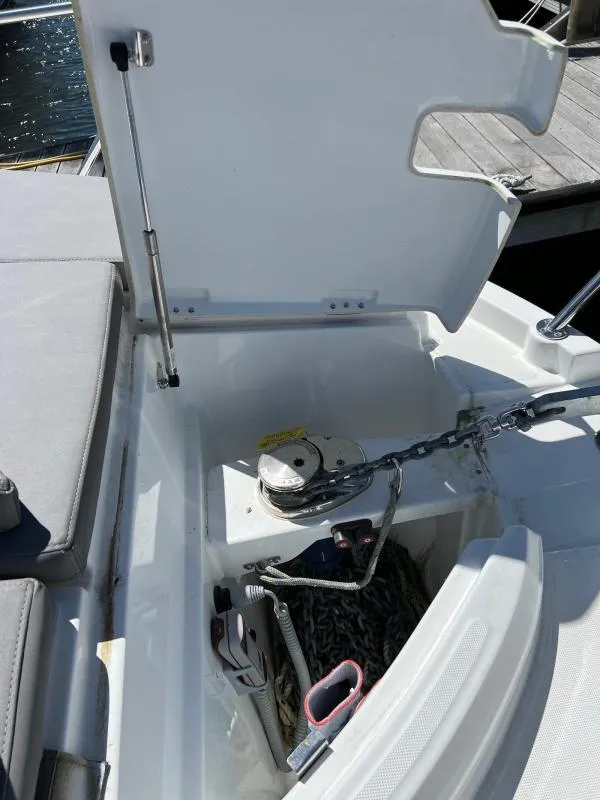 Slide: The Image of Anchor compartment of 2023 Beneteau Antares 8 boat with chain and winch. - 24