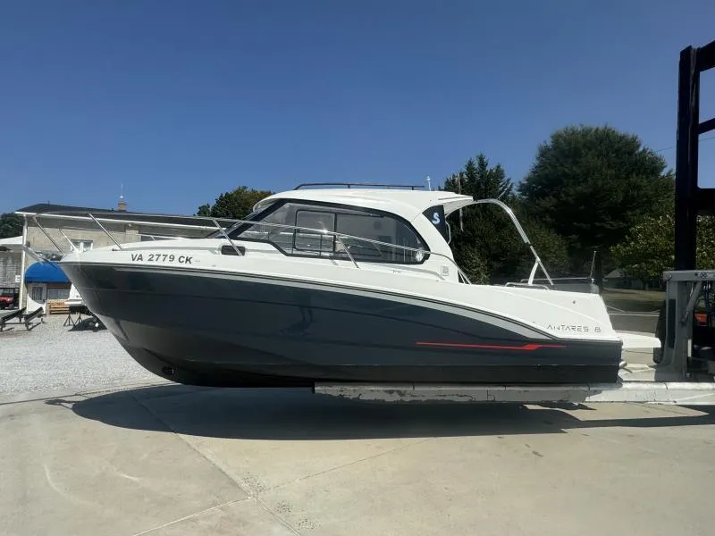 Slide: The Image of 2023 Beneteau Antares 8 boat on a lift, side view, outdoors. - 4