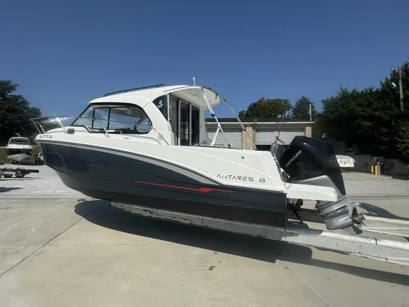 Slide: The Image of 2023 Beneteau Antares 8 boat on trailer, side view, outdoors. - 5
