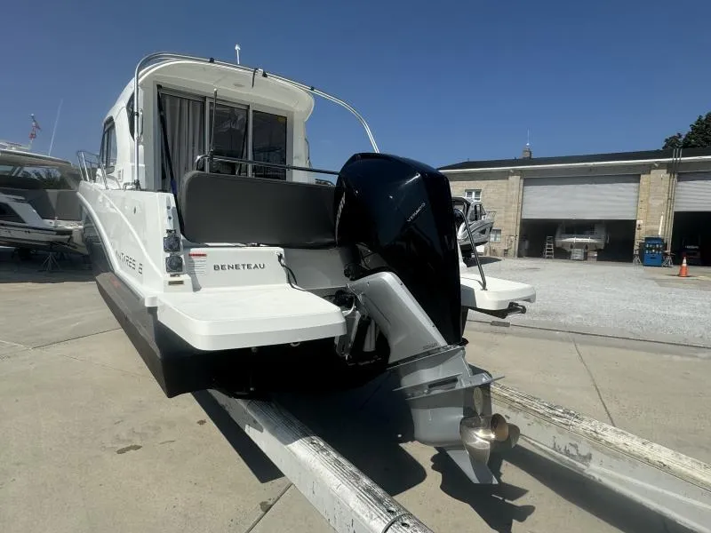 Slide: The Image of 2023 Beneteau Antares 8 boat on trailer, rear view with outboard motor. - 6