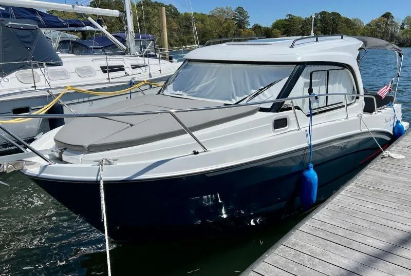 Slide: The Image of 2023 Beneteau Antares 8 docked at marina, featuring sleek design and modern amenities. - 7