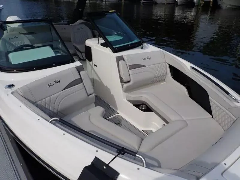 Slide: The Image of 2024 Sea Ray SLX 260 Outboard boat interior with luxurious seating and sleek design. - 13