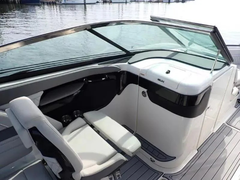 Slide: The Image of 2024 Sea Ray SLX 260 Outboard interior with sleek seating and modern dashboard design. - 18