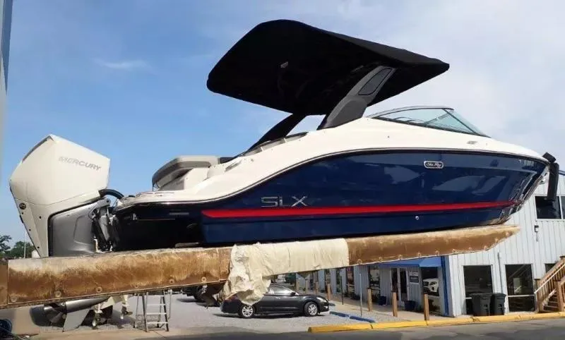 Slide: The Image of 2024 Sea Ray SLX 260 Outboard boat with Mercury engine, displayed outdoors. - 6