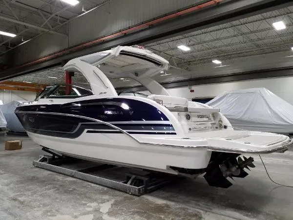 Slide: The Image of 2019 Formula Boats 350 CBR in a showroom, showcasing sleek design and modern features. - 10