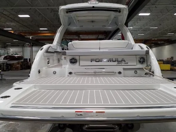 Slide: The Image of 2019 Formula Boats 350 CBR, rear view in a warehouse setting. - 12