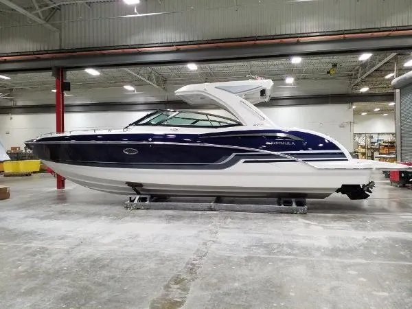 Slide: The Image of 2019 Formula Boats 350 CBR in a warehouse setting, side view. - 5