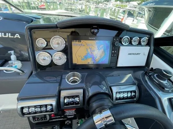 Slide: The Image of Dashboard of a 2019 Formula Boats 350 CBR with navigation and control instruments. - 8