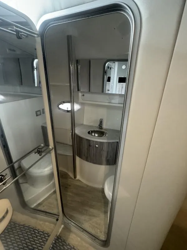 Slide: The Image of Modern bathroom interior in 2023 Formula Boats 40 PC, featuring sleek design and compact amenities. - 14