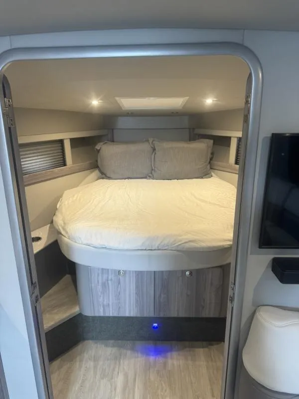 Slide: The Image of 2023 Formula Boats 40 PC cabin interior with bed and modern lighting. - 18