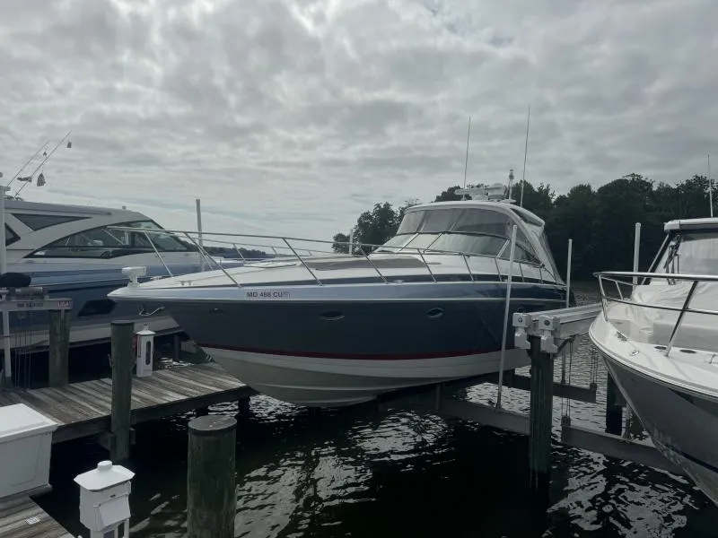 Slide: The Image of 2023 Formula Boats 40 PC docked at marina under cloudy sky. - 4