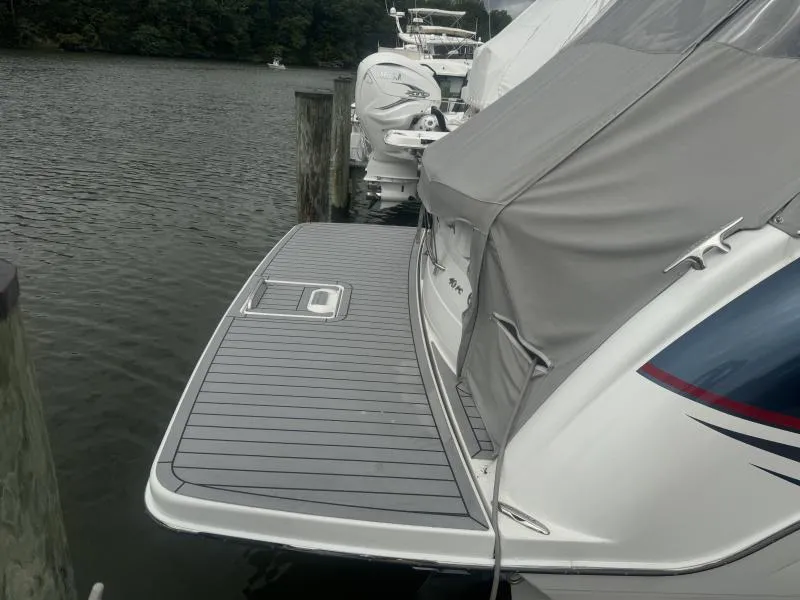 Slide: The Image of 2023 Formula Boats 40 PC docked with covered deck, featuring sleek design and modern amenities. - 5