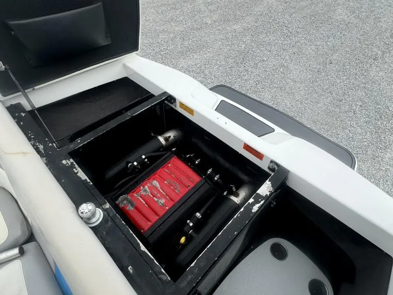 Slide: The Image of Open engine compartment of 2013 Malibu Wakesetter 23 LSV boat, showing internal components. - 15