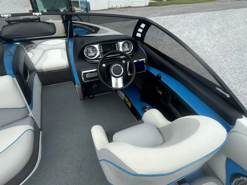 Slide: The Image of 2013 Malibu Wakesetter 23 LSV interior with steering wheel and seating. - 17