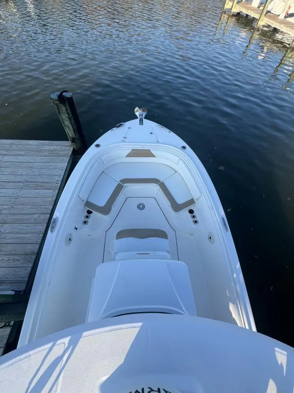 Slide: The Image of 2020 Edgewater 280 Center Console boat docked on calm water. - 15