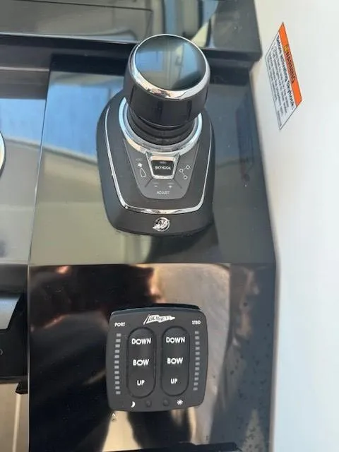 Slide: The Image of Control panel of a 2020 Formula Boats 380 SSC, featuring joystick and trim tab controls. - 25