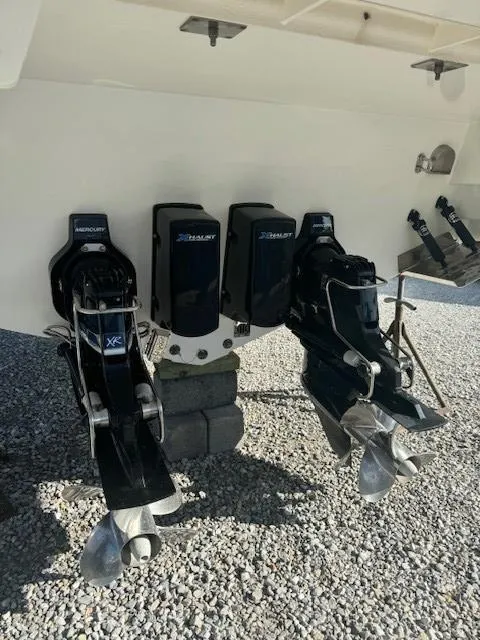 Slide: The Image of 2020 Formula Boats 380 SSC outboard motors on gravel surface. - 6