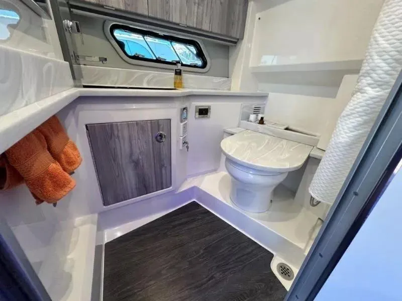Slide: The Image of Modern bathroom in 2022 Formula 430 Super Sport Crossover boat, featuring sleek design and amenities. - 17