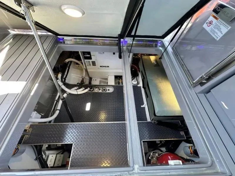 Slide: The Image of Engine compartment of 2022 Formula 430 Super Sport Crossover with Kohler generator. - 23