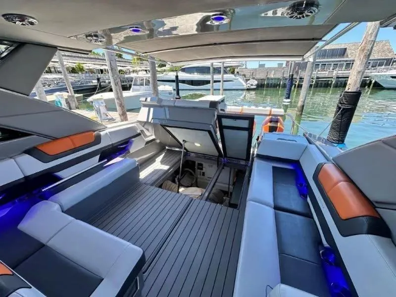 Slide: The Image of Luxurious 2022 Formula 430 Super Sport Crossover yacht interior with modern seating and ambient lighting. - 25