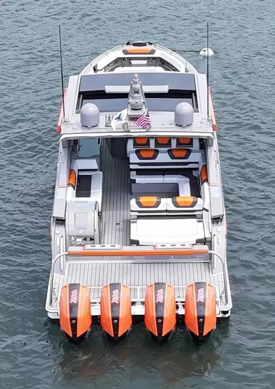 Slide: The Image of 2022 Formula 430 Super Sport Crossover boat with four orange outboard motors on water. - 4