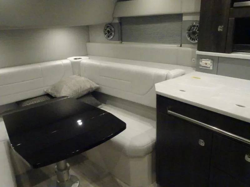 Slide: The Image of Interior of 2021 Formula 430 Super Sport Crossover with sleek seating and modern table. - 17