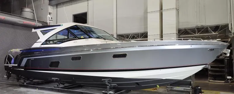 Slide: The Image of 2021 Formula 430 Super Sport Crossover boat in a showroom, side view. - 20
