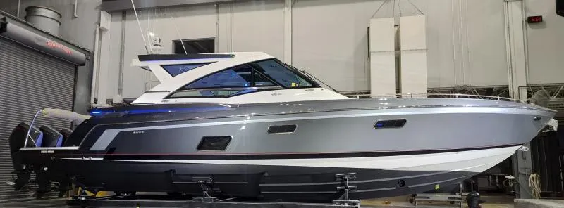 Slide: The Image of 2021 Formula 430 Super Sport Crossover boat in a showroom, side view. - 21