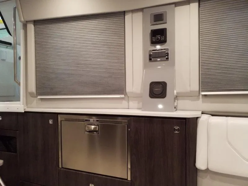 Slide: The Image of Interior of 2021 Formula 430 Super Sport Crossover with modern cabinetry and appliances. - 6