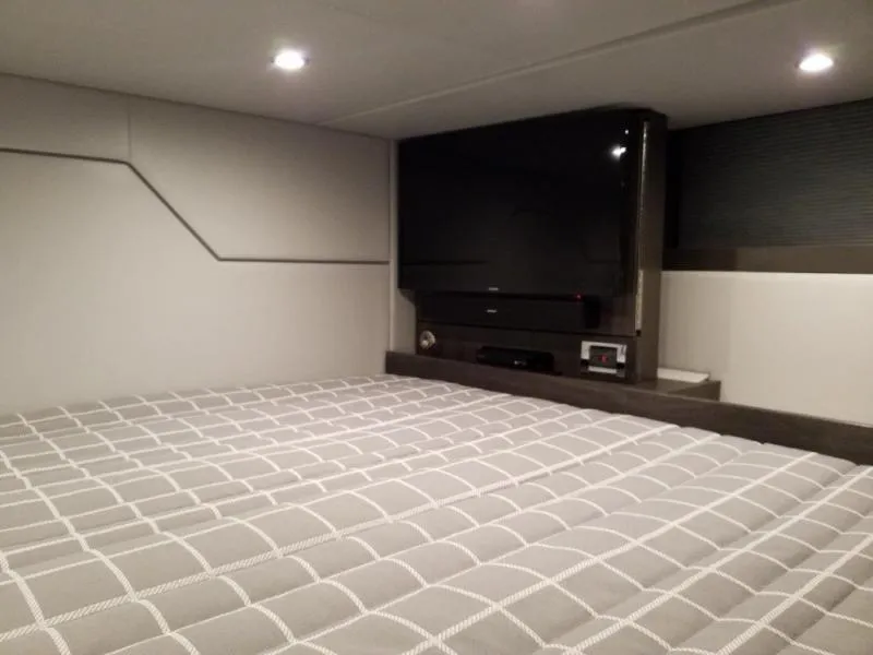 Slide: The Image of Interior cabin of 2021 Formula 430 Super Sport Crossover with bed and TV. - 8