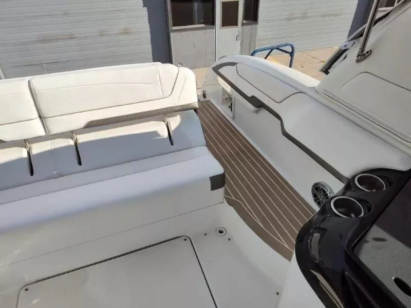 Slide: The Image of 2018 Formula 350 Crossover Bowrider interior with white seating and wood-style flooring. - 16