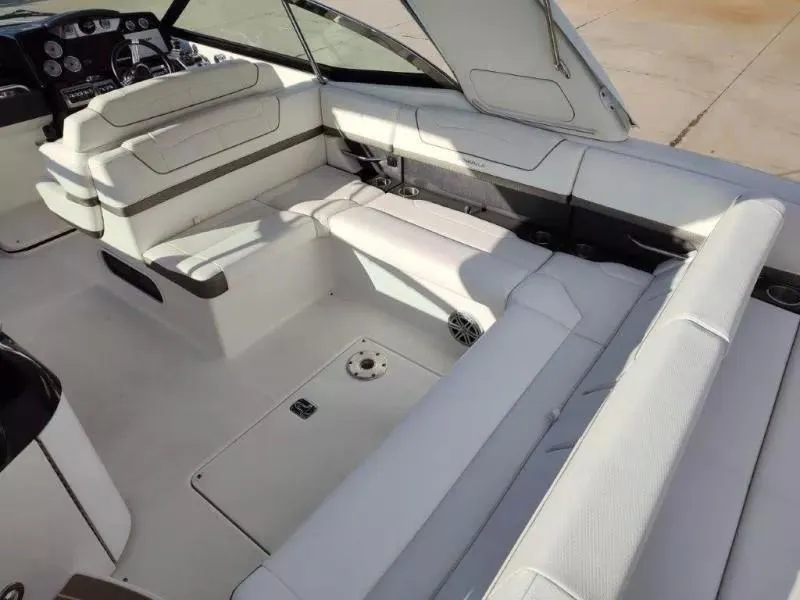 Slide: The Image of 2018 Formula 350 Crossover Bowrider interior with white seating and dashboard view. - 18