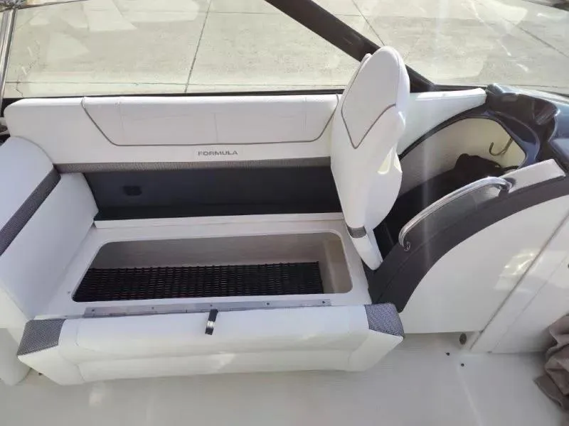 Slide: The Image of 2018 Formula 350 Crossover Bowrider interior seating with storage compartment. - 22
