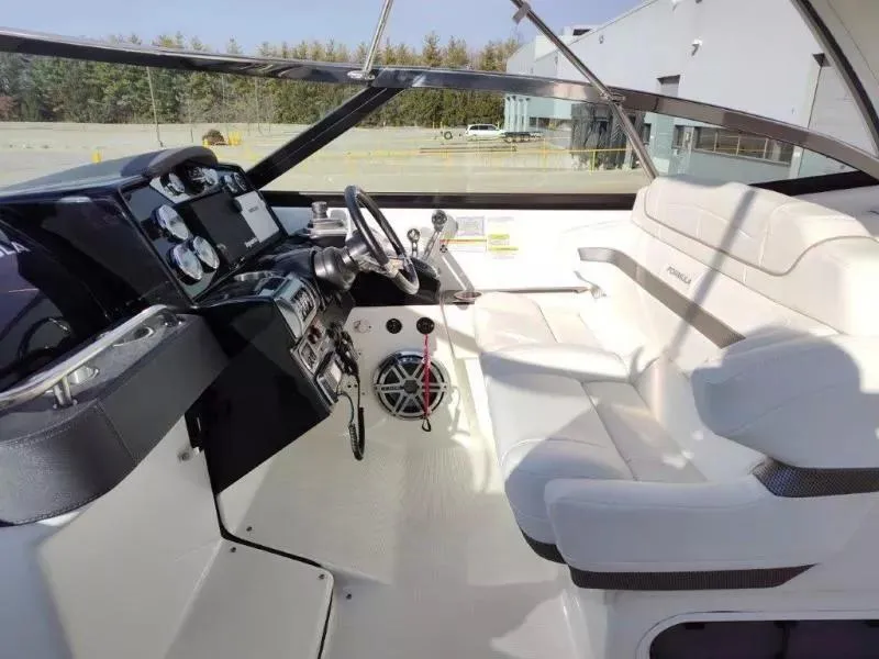 Slide: The Image of 2018 Formula 350 Crossover Bowrider interior with sleek dashboard and comfortable seating. - 23