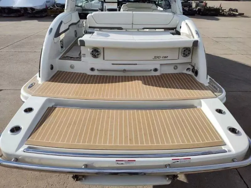 Slide: The Image of 2018 Formula 350 Crossover Bowrider, rear view with spacious deck and seating. - 9